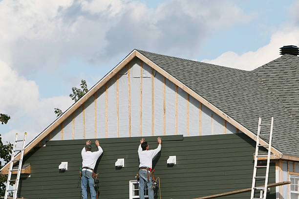 Professional Storm Damage Siding Repair technician working in Wilmington, MA